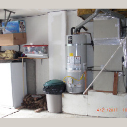 Clean water heater installation next to furnace
