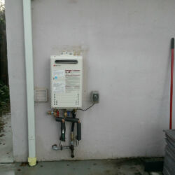 Back wall outdoor tankless water heater installation