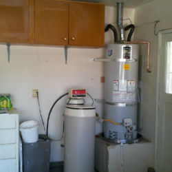 Clean water heater installation in a a garage