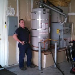 Proud water heater installation job in a garage