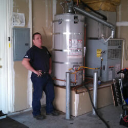 Proud water heater installation job in a garage