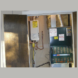 tannkless water heater next to furnace